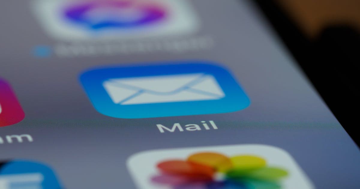 Email app icon on smartphone representing BIMI brand logos